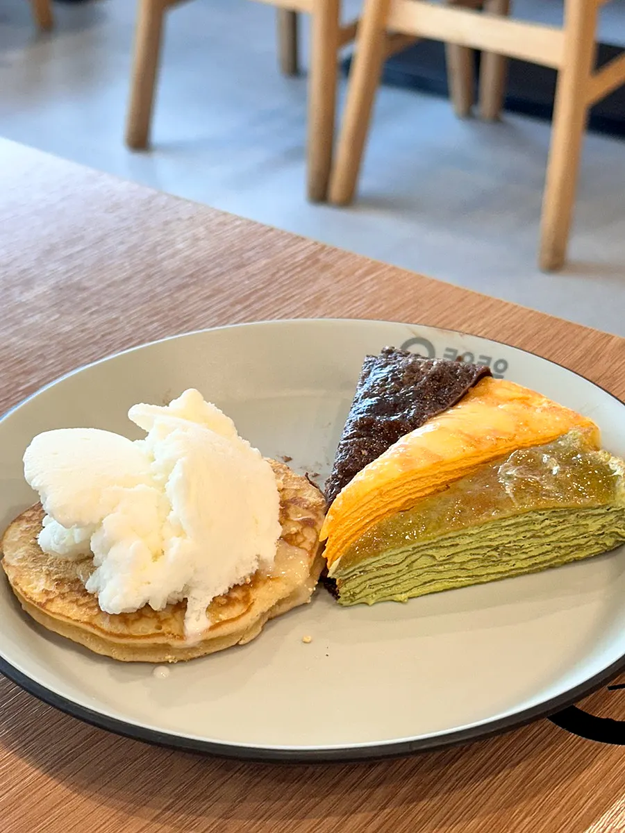 A dessert plate with pancakes and crepe cake