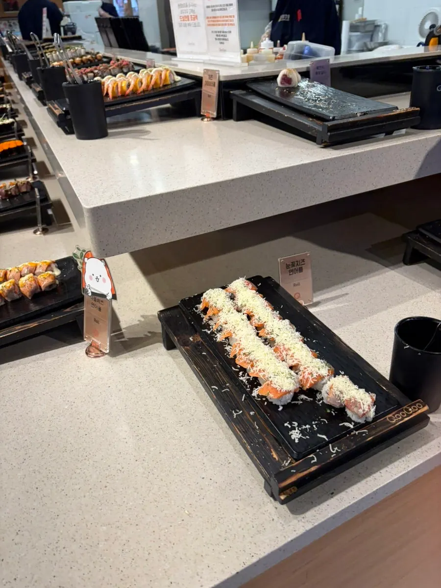 Sushi pieces topped with various sauces