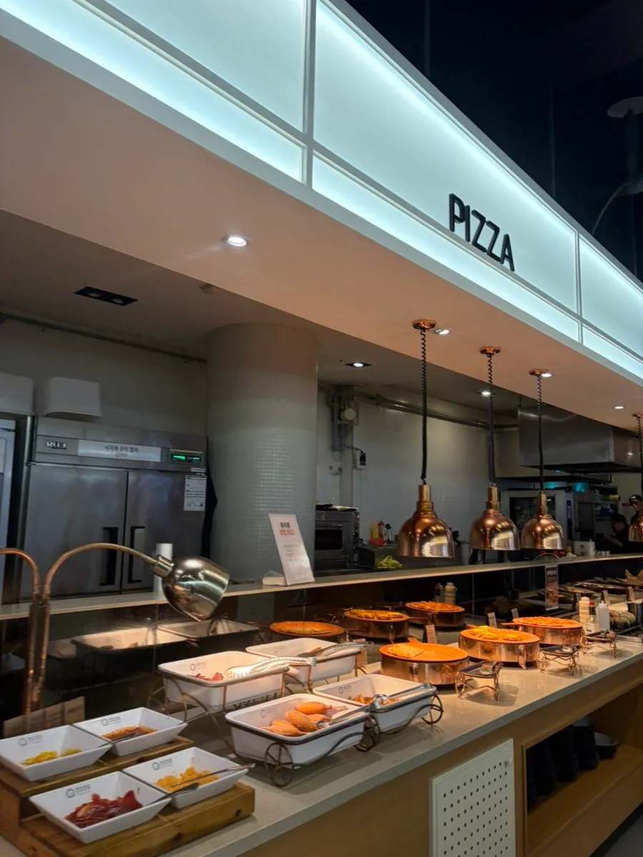 Cooked dishes including pizza, pasta, and pork ribs
