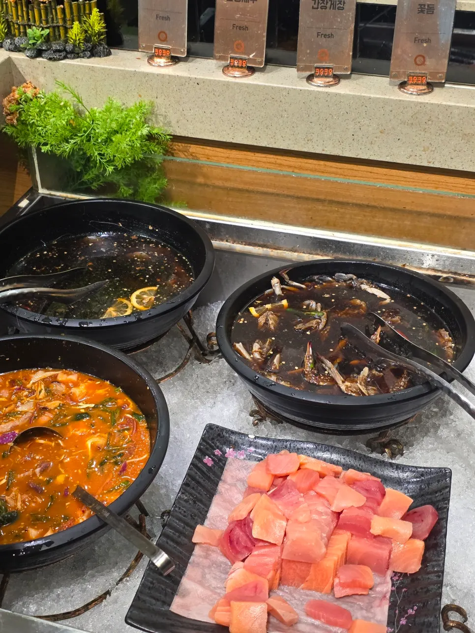 Seafood corner with soy-marinated shrimp, marinated crab, and mulhoe