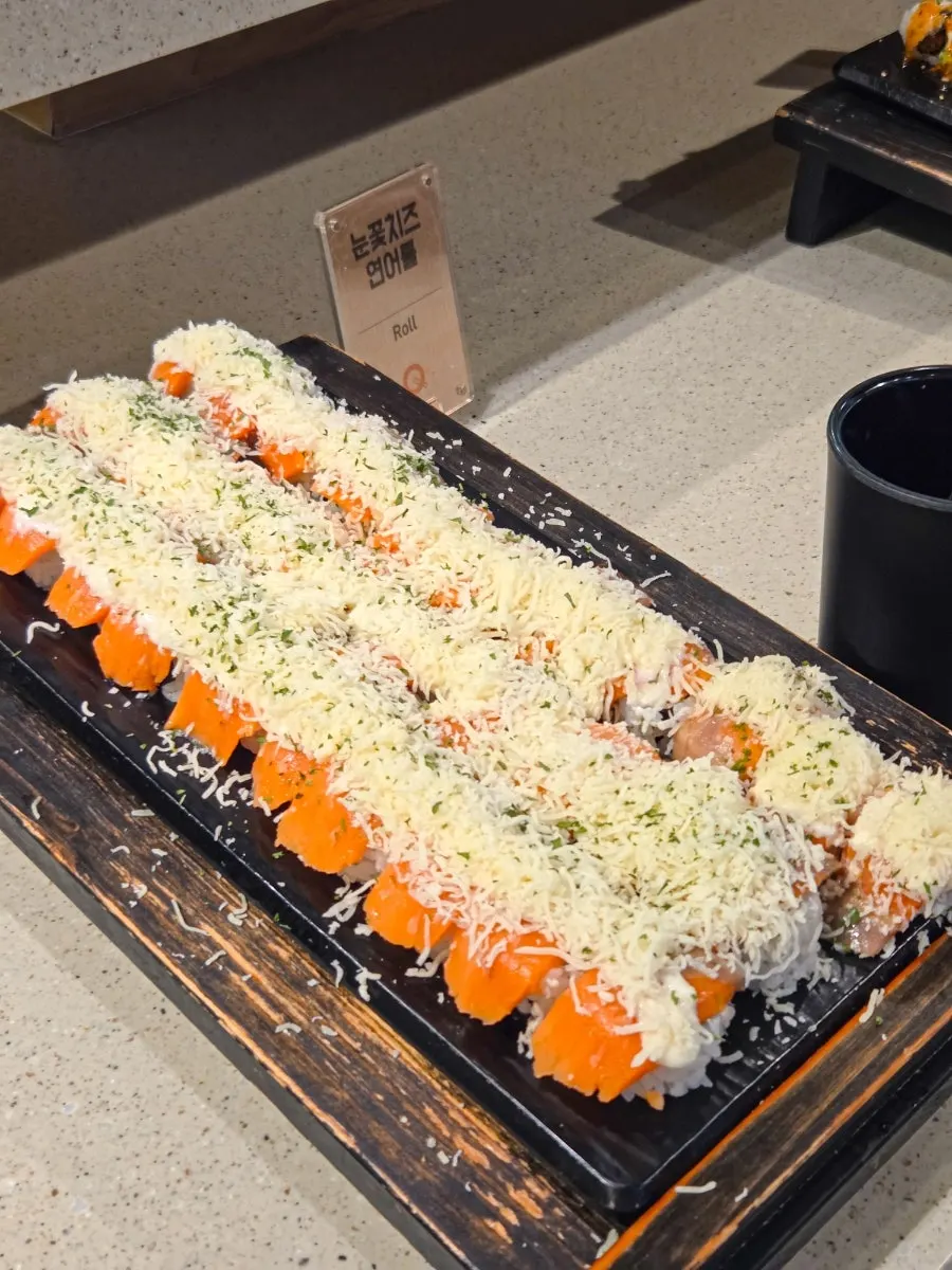 Plates laid out at the sushi buffet counter