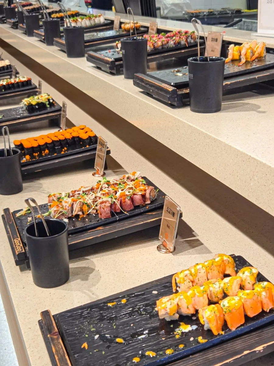 Menu items displayed at the sushi buffet corner