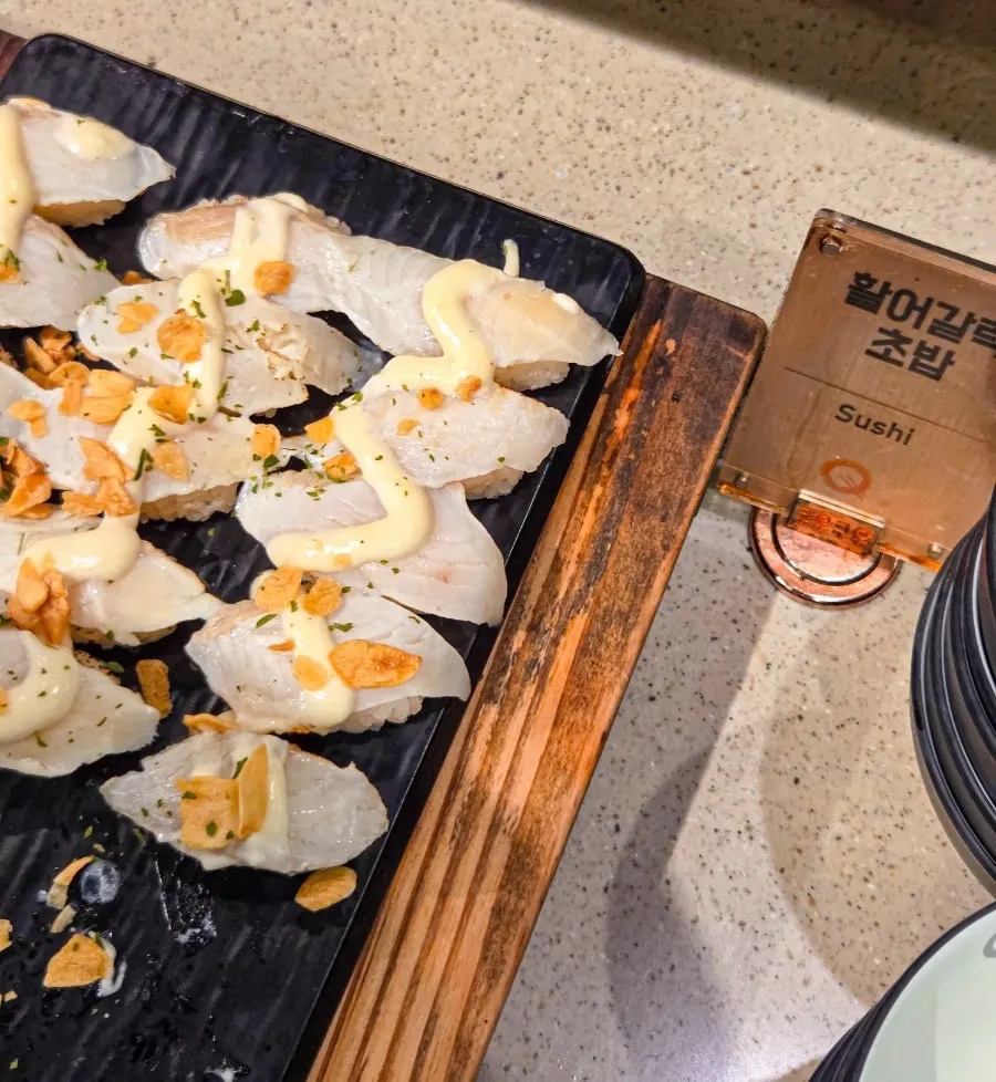 Amberjack and tuna belly sushi on display