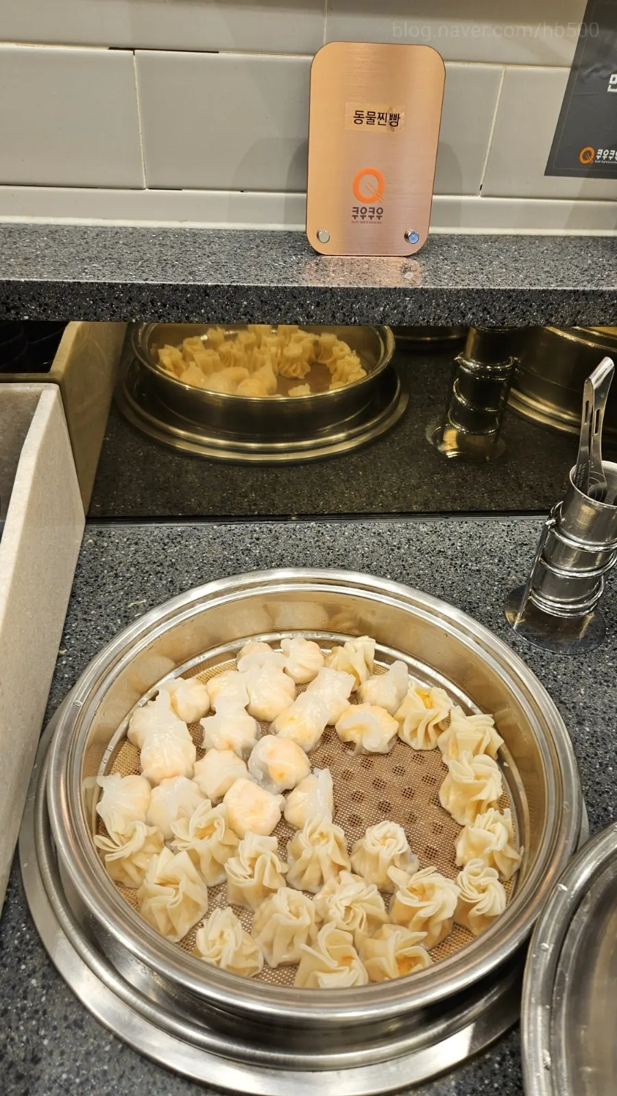 Vertical shot of plated food at KuuKuu Gold Bupyeong Branch