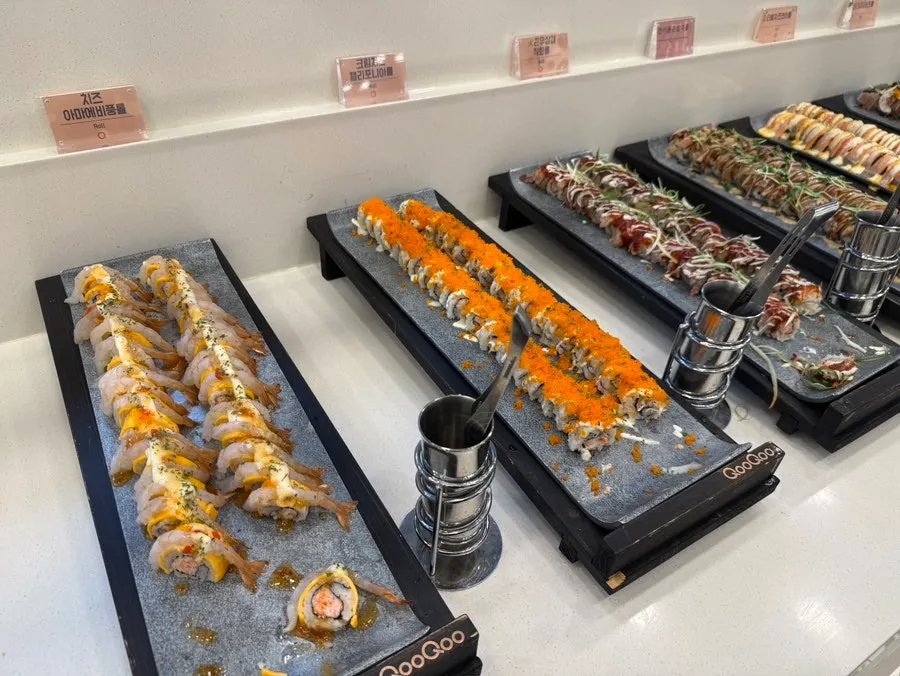 Assorted rolls including cheese shrimp and kimchi tuna rolls