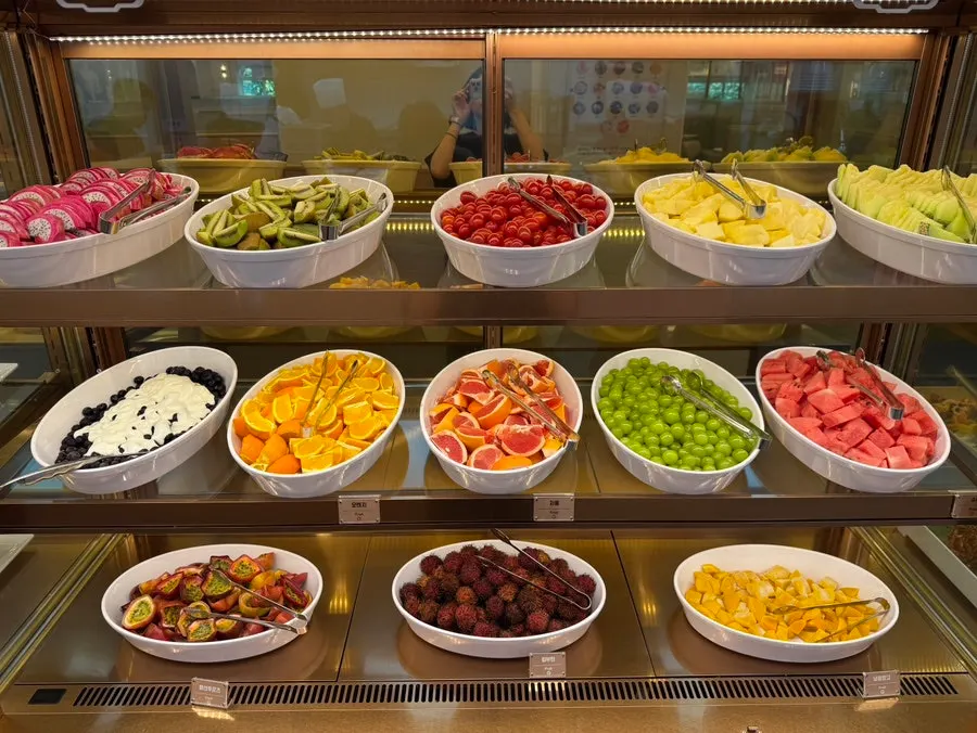 Corner displaying salads and fruit