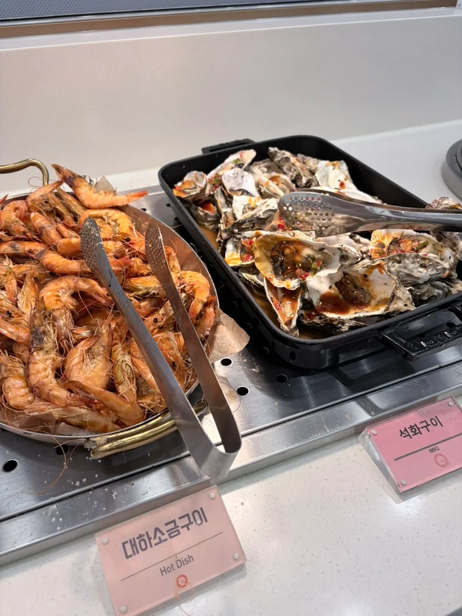 Buffet hot food stocked with fried rice and grilled items