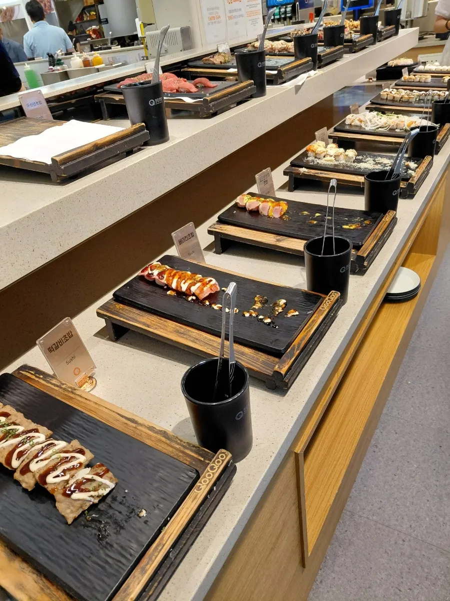 Buffet corner with sushi, rolls and fried dishes