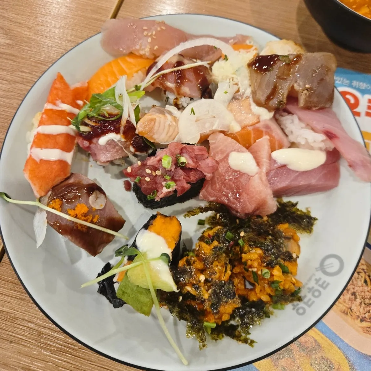 First plate piled high with sushi and rolls