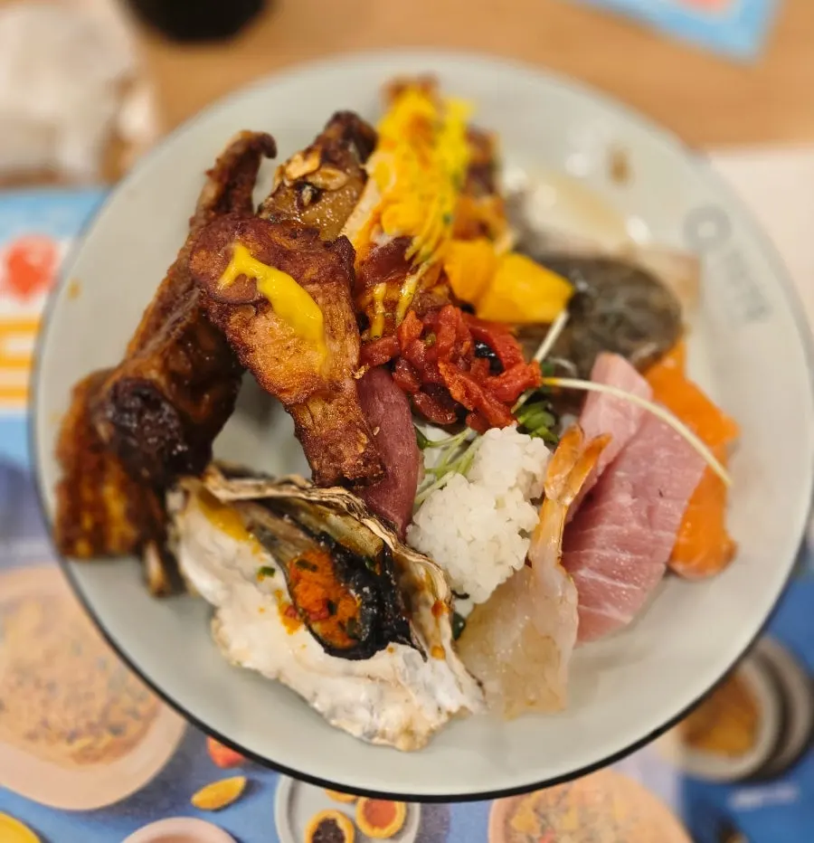 Plate with salmon, tuna and rolls picked out