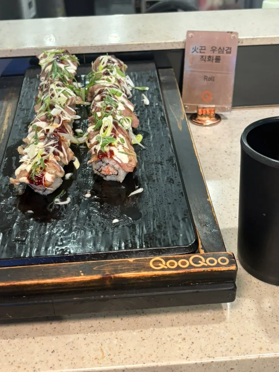 Corner with aged kimchi salmon futomaki and spicy fried tofu crunch roll