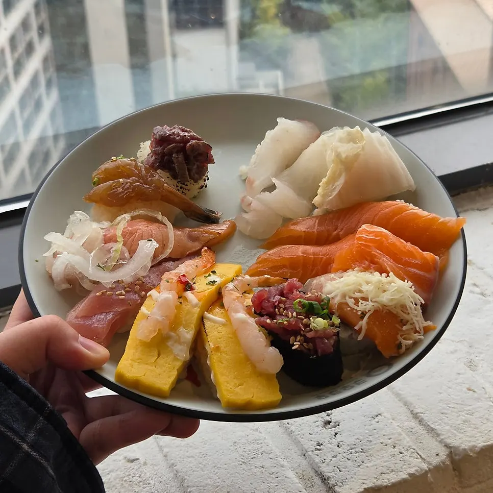 Plate of salmon sushi with generous cuts of fish