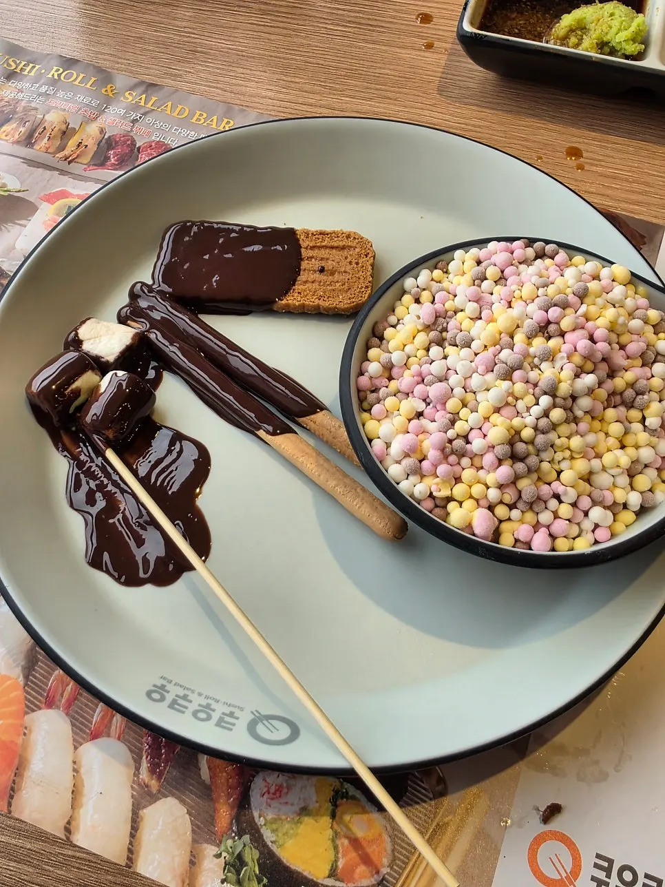 Chocolate fondue with cookies and marshmallows