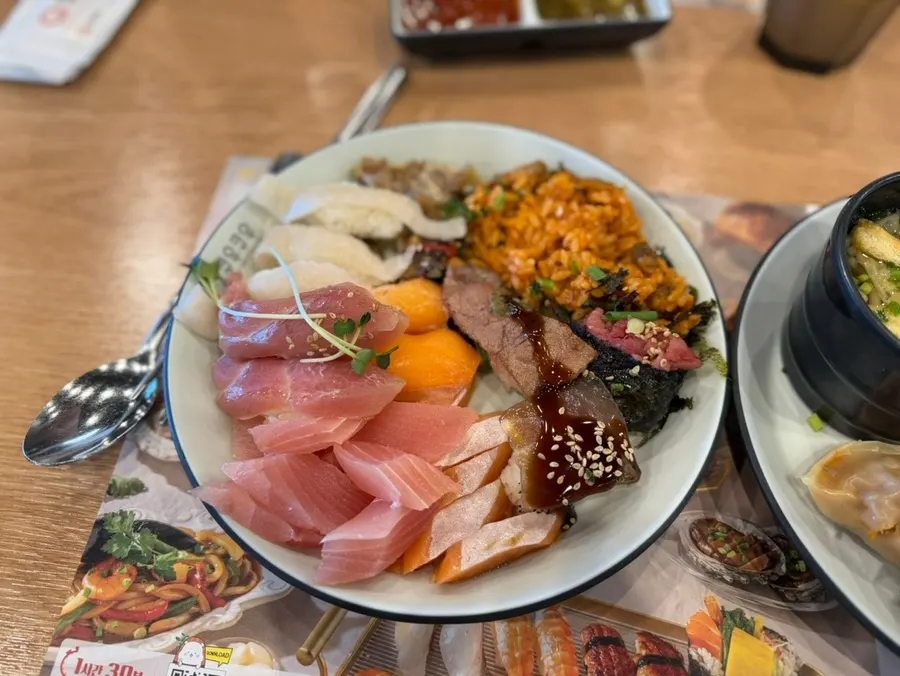 Plate of salmon sushi and rolls