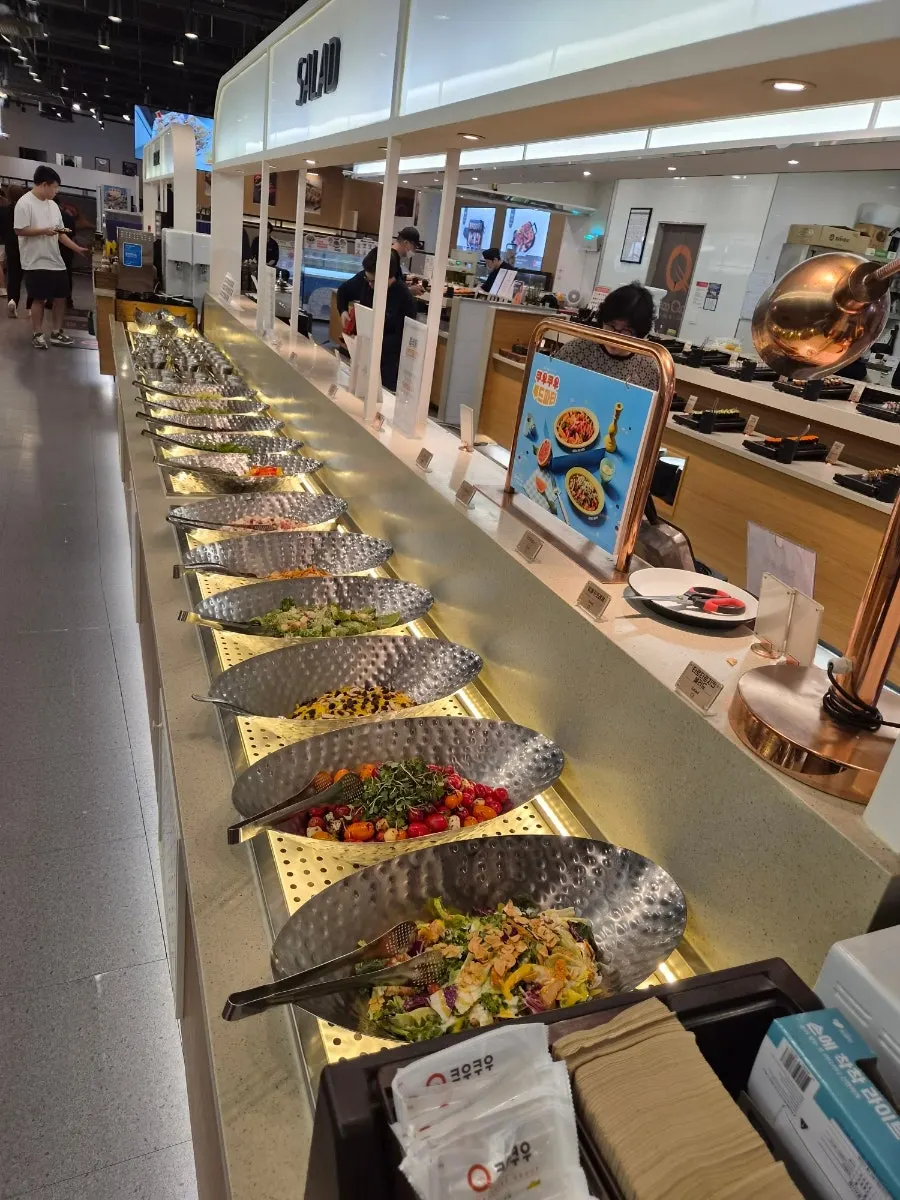 Neatly arranged raw fish sushi and gunkan sushi display