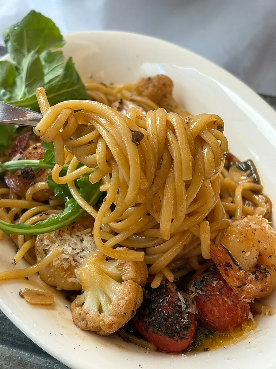 Healthy shrimp oil pasta loaded with roasted vegetables