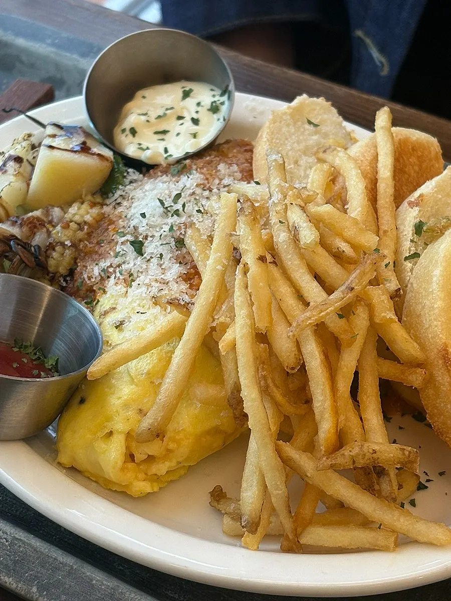 Omelette served with roasted potatoes and mushrooms