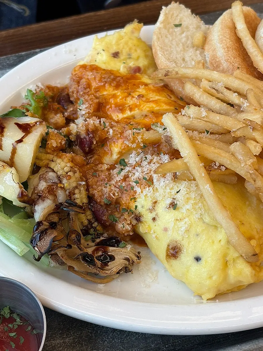 A hearty plate of omelette and fries