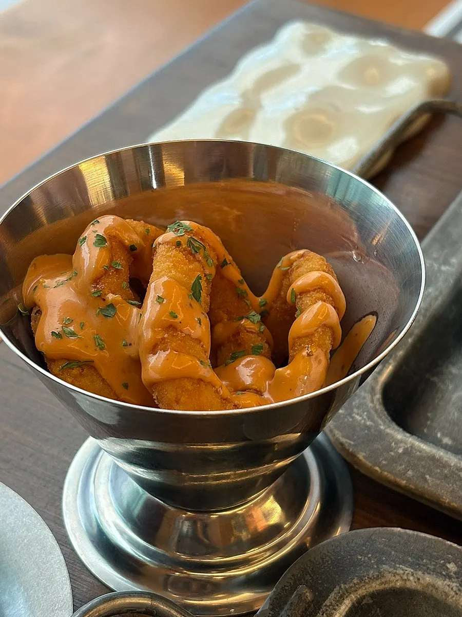 Onion rings with spicy sauce received for a receipt review