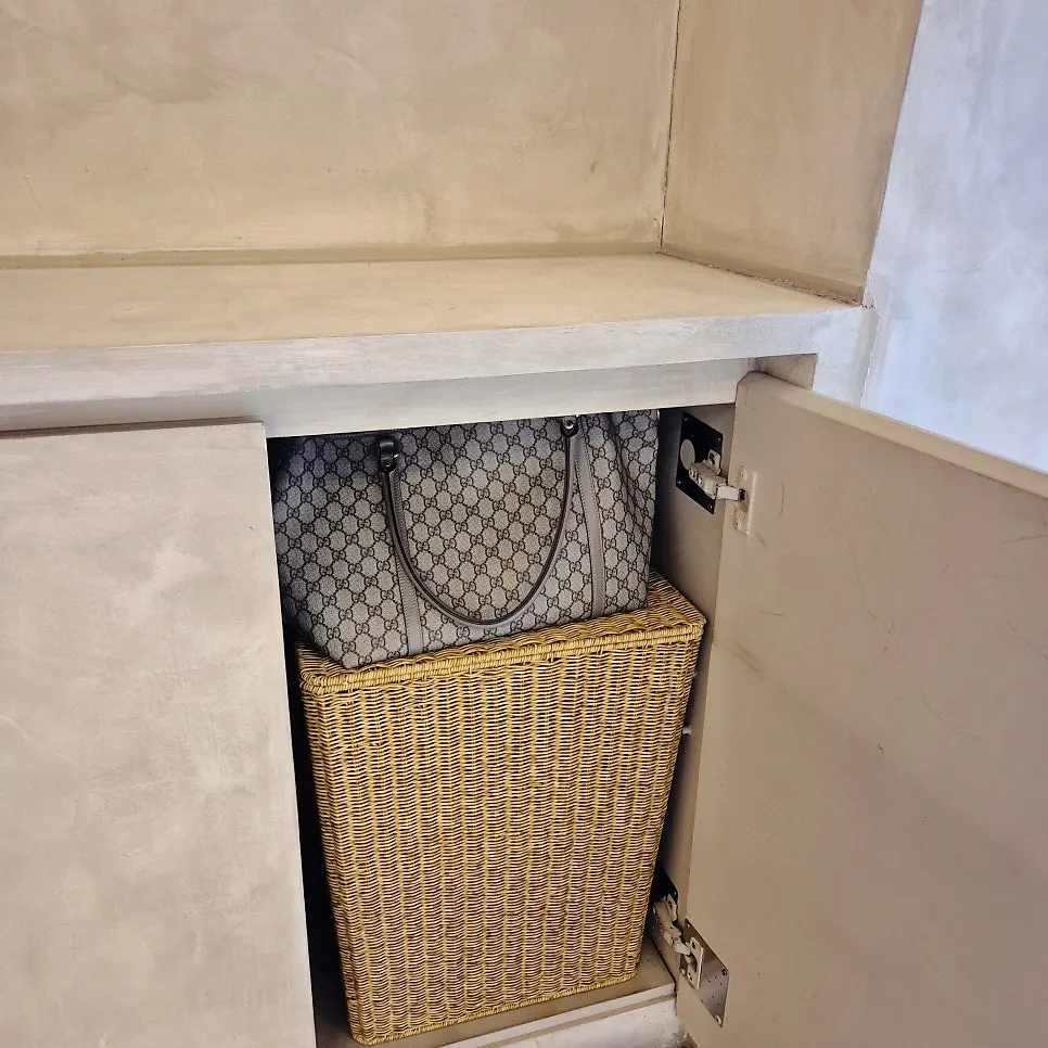 Coat and bag storage nook behind the bar seating