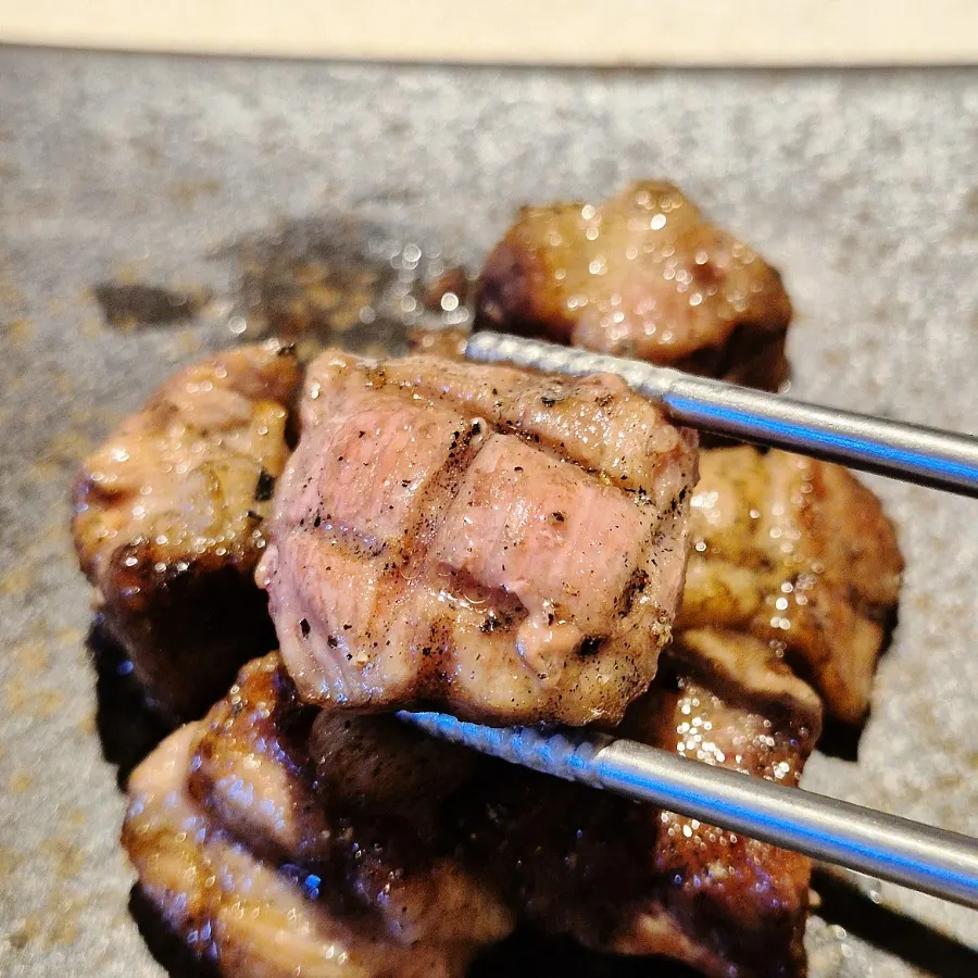 A course dish being prepared in the open kitchen