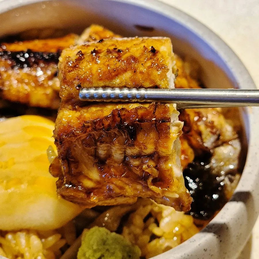 A bite taken from the eel donburi