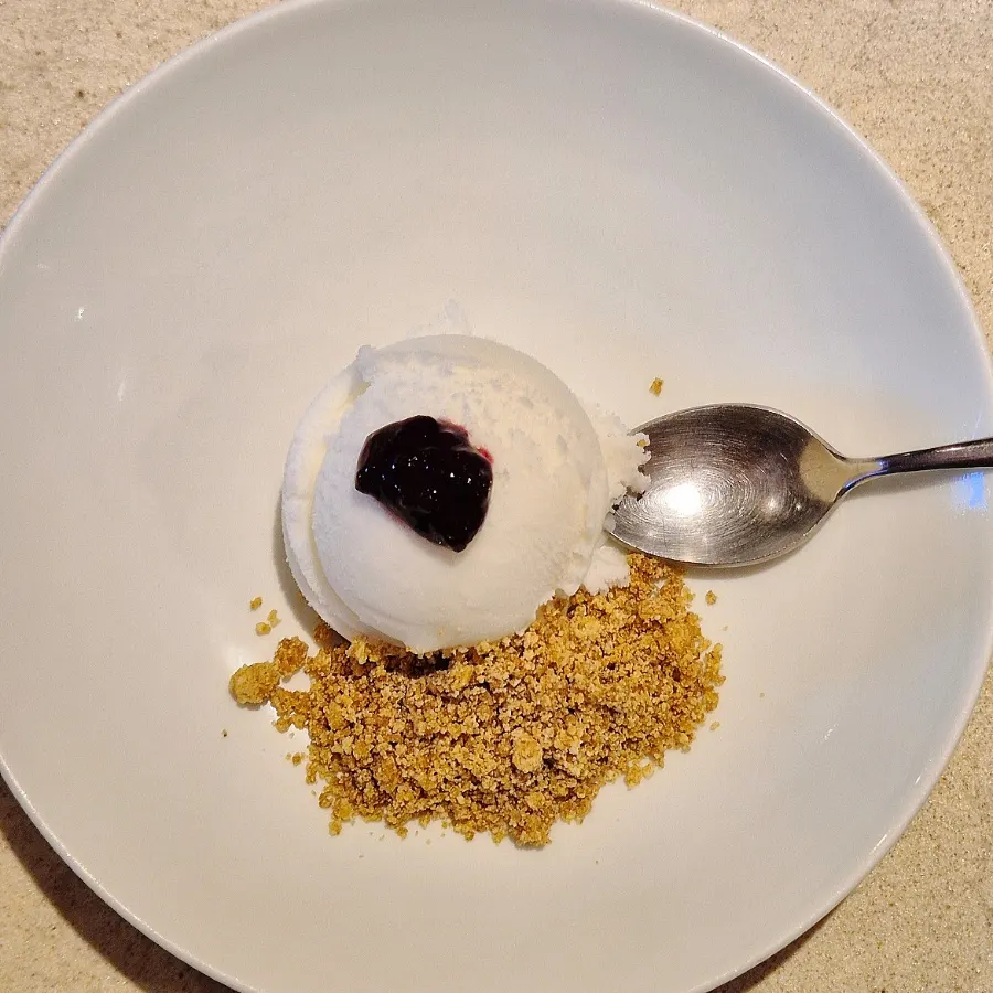 Yogurt sherbet dessert topped with thyme