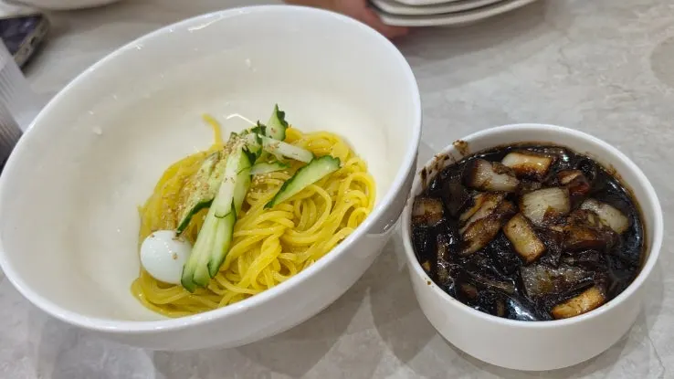 Table spread of ordered jjajangmyeon and tangsuyuk
