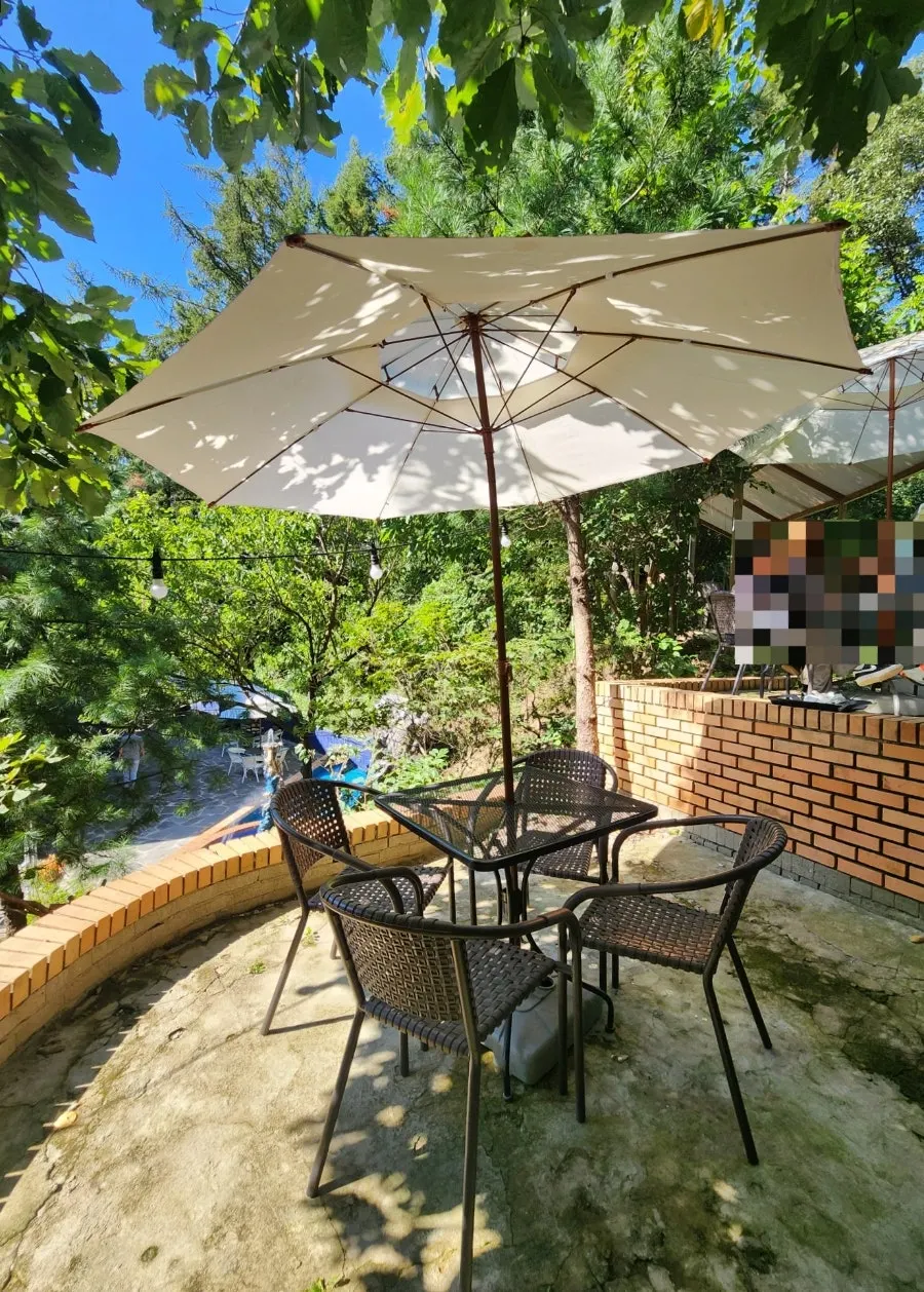Outdoor fountain and surrounding landscaping