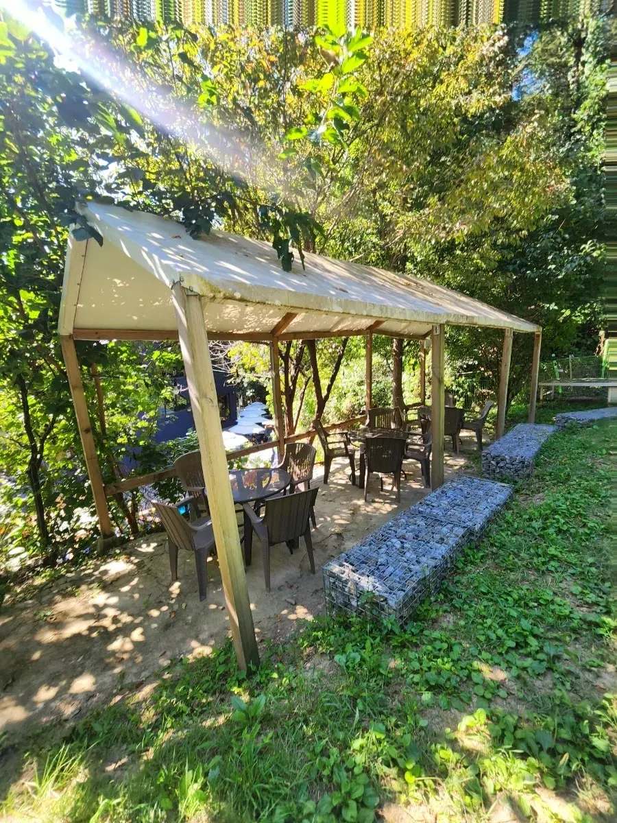 Outdoor table area leading up the hill