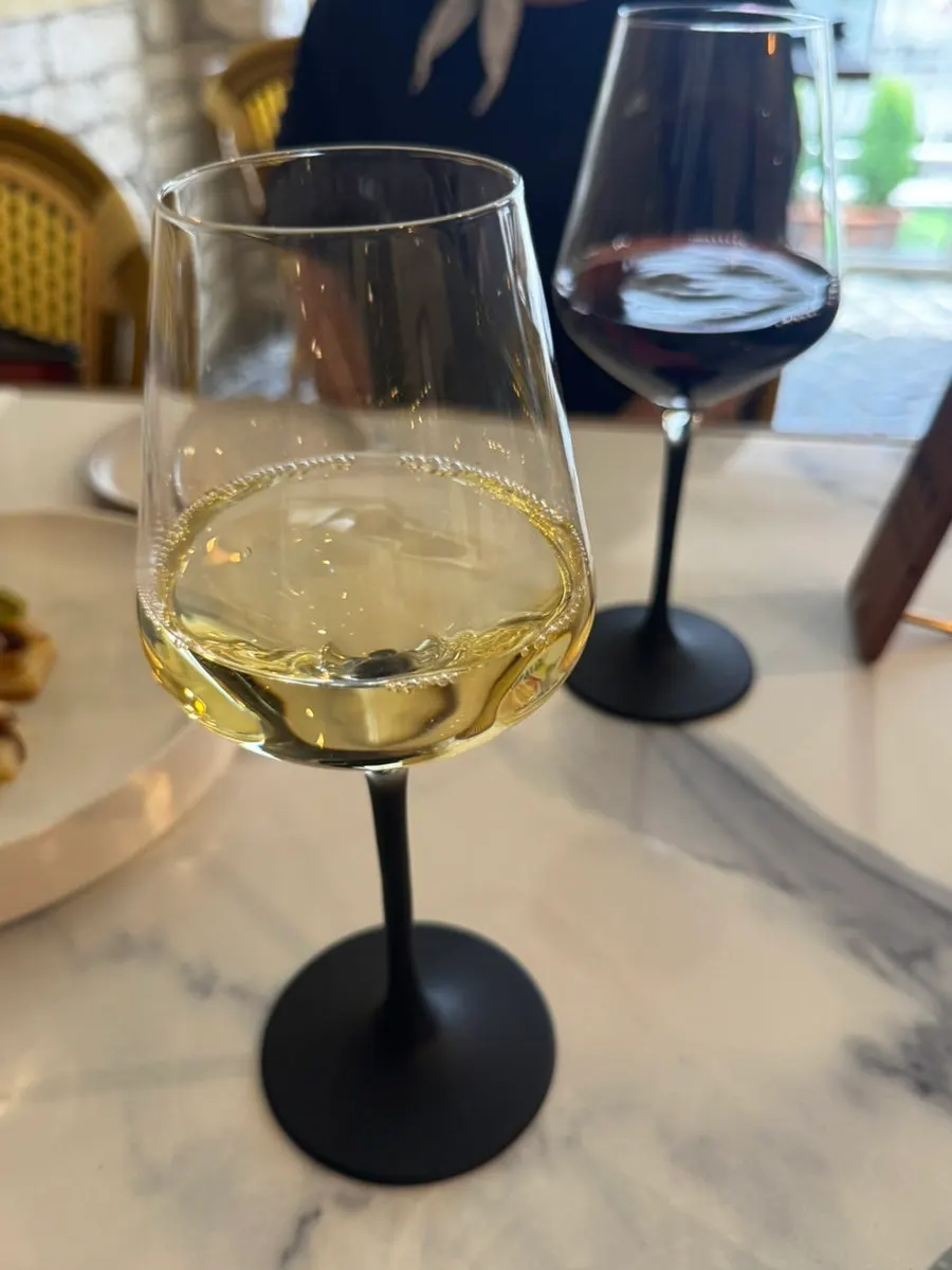 A glass of wine enjoyed at LA RUELLE in the daytime