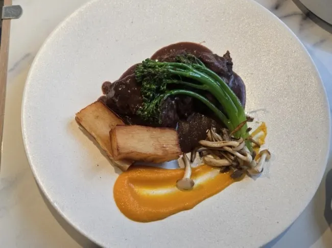 Carrot purée and broccolini served with the boeuf bourguignon