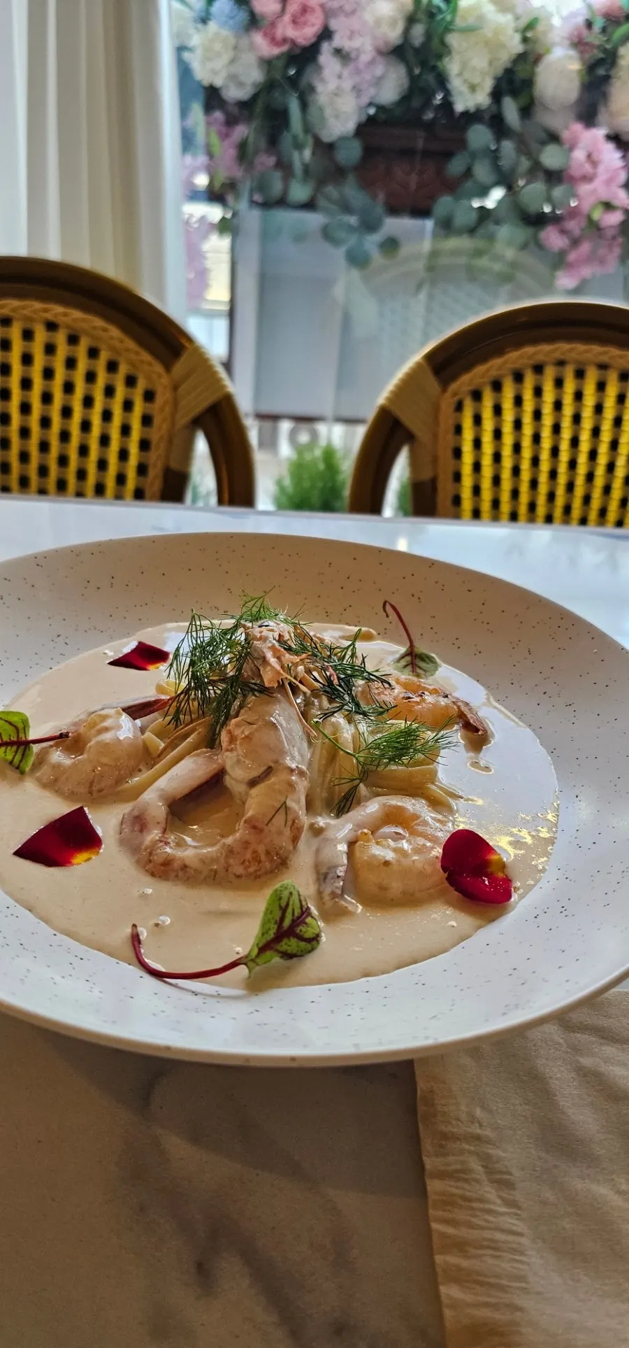 LA RUELLE's bisque pasta topped with large shrimp