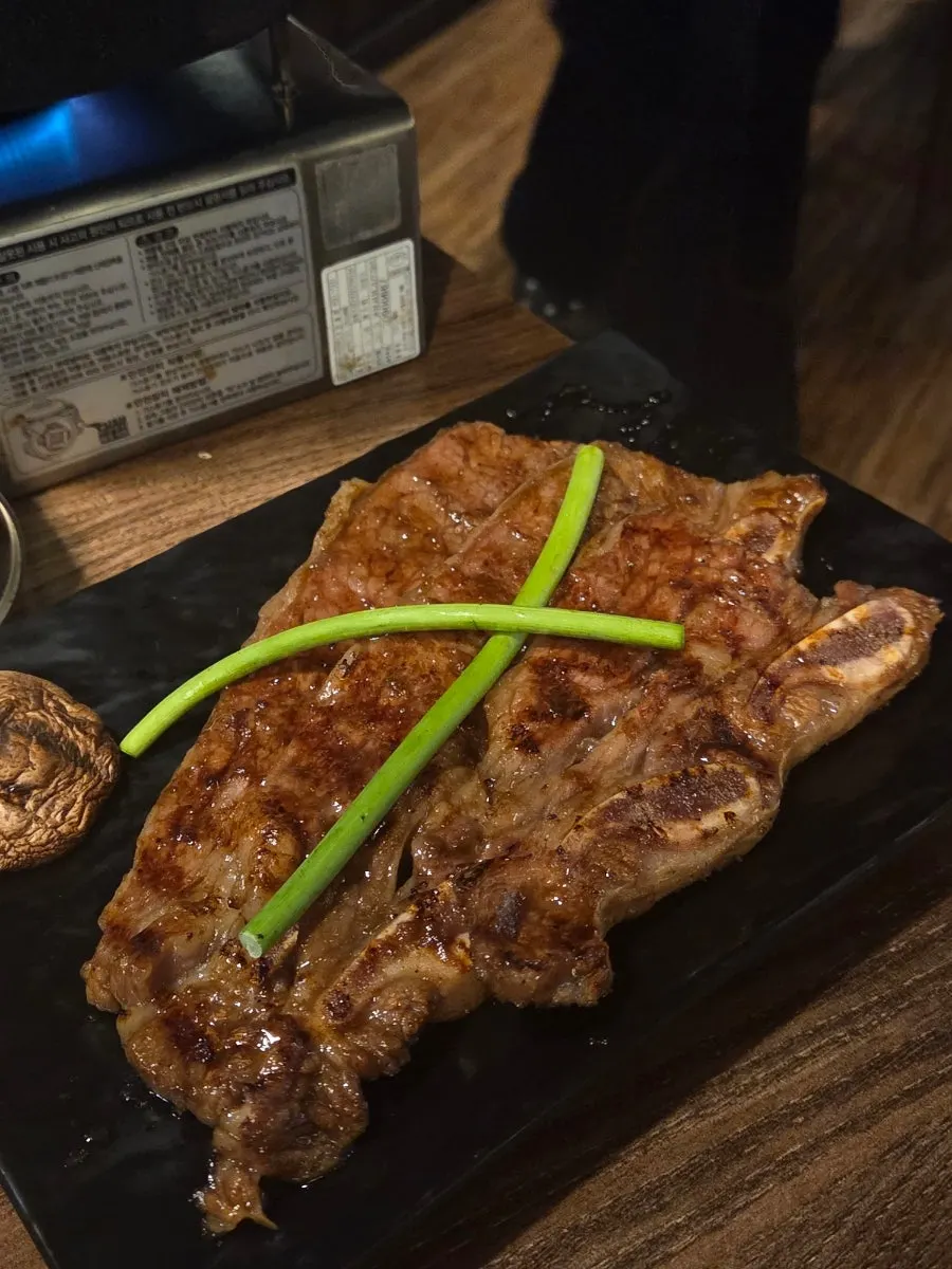 A cut piece of marinated grilled beef ready to eat