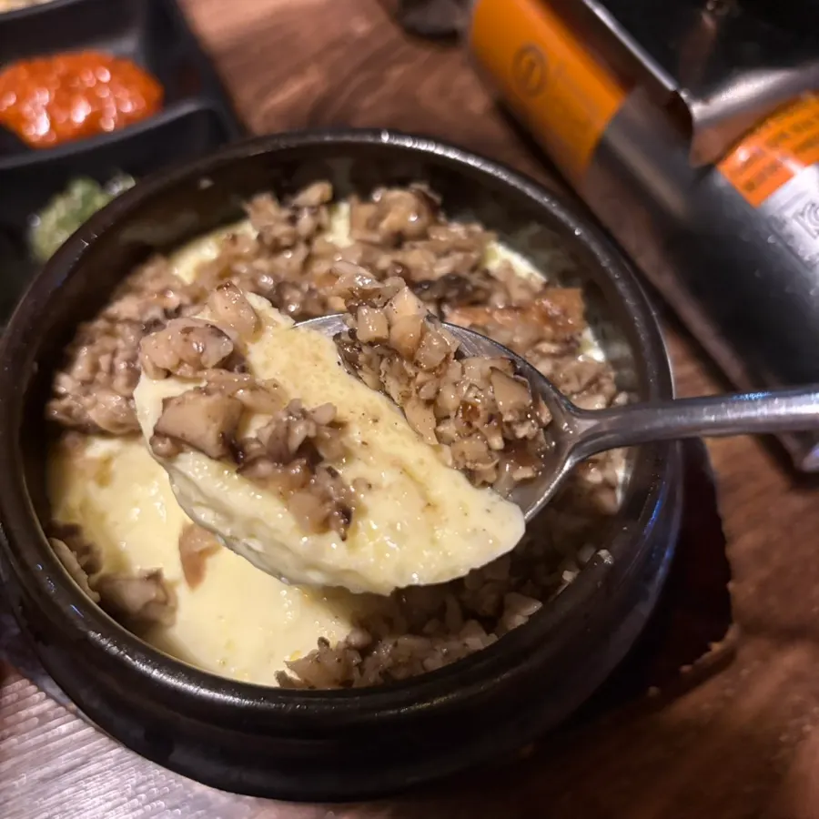 Close-up of the truffle steamed egg topped with diced shiitake mushroom