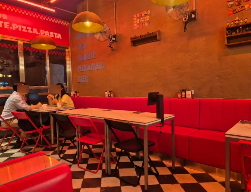 View of the dining hall seating at Raccoon Pizza Mapo Station branch