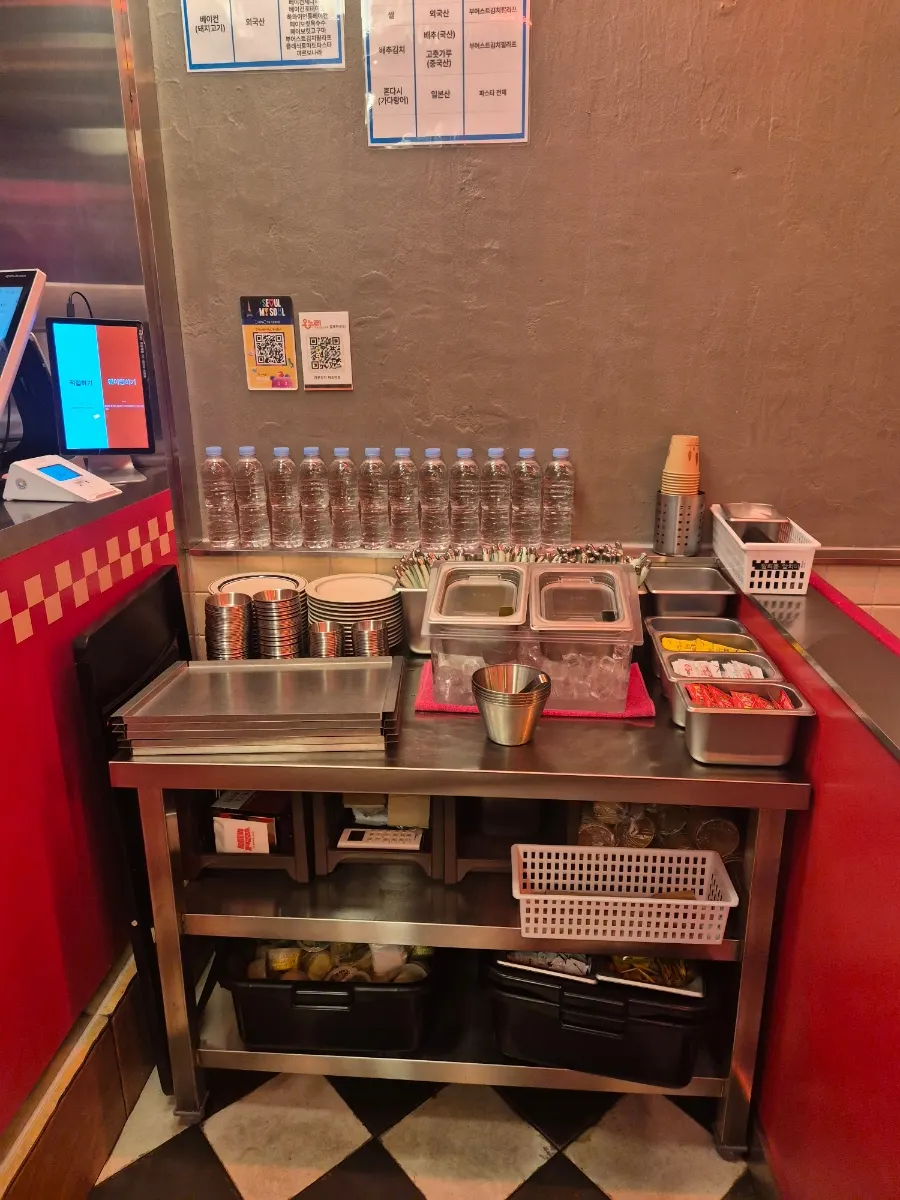 Self-bar with pickles, jalapeños, and garlic dipping sauce