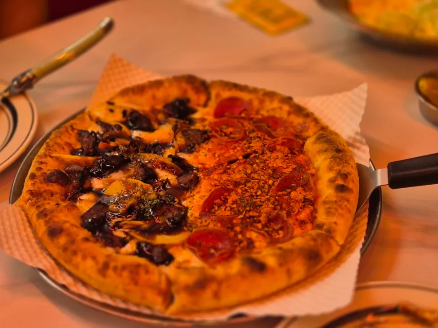 A whole half-and-half pizza topped with double cheese
