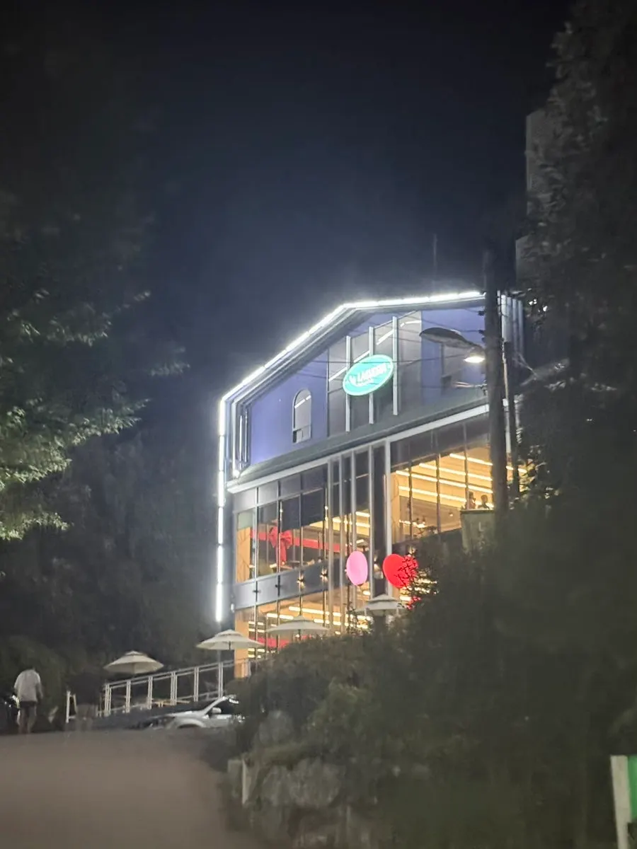 La Cuesta's exterior and staircase entrance seen in the evening
