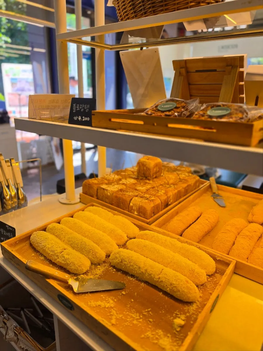 Bakery items sitting on the display shelf