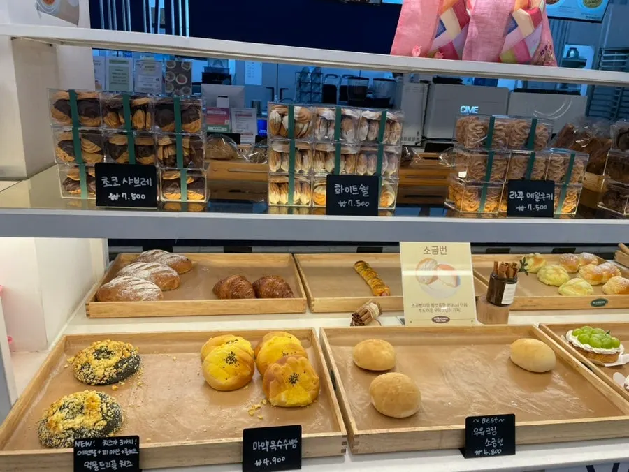 Bakery display case filled with various breads