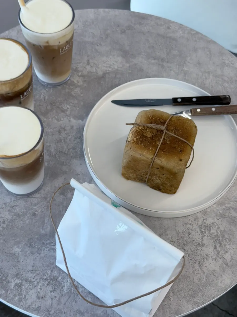 Mejubread and latte shared at the table