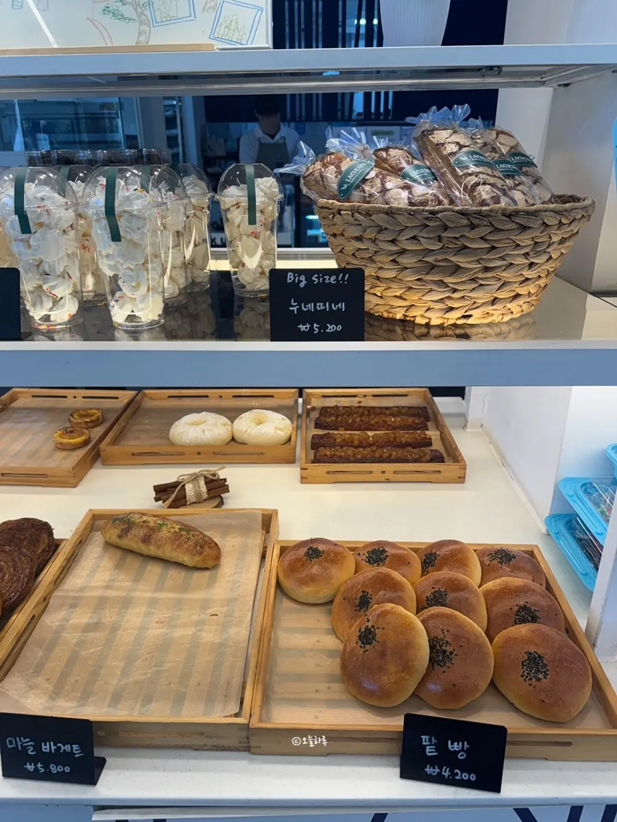 Bakery display with canelé and red bean bread