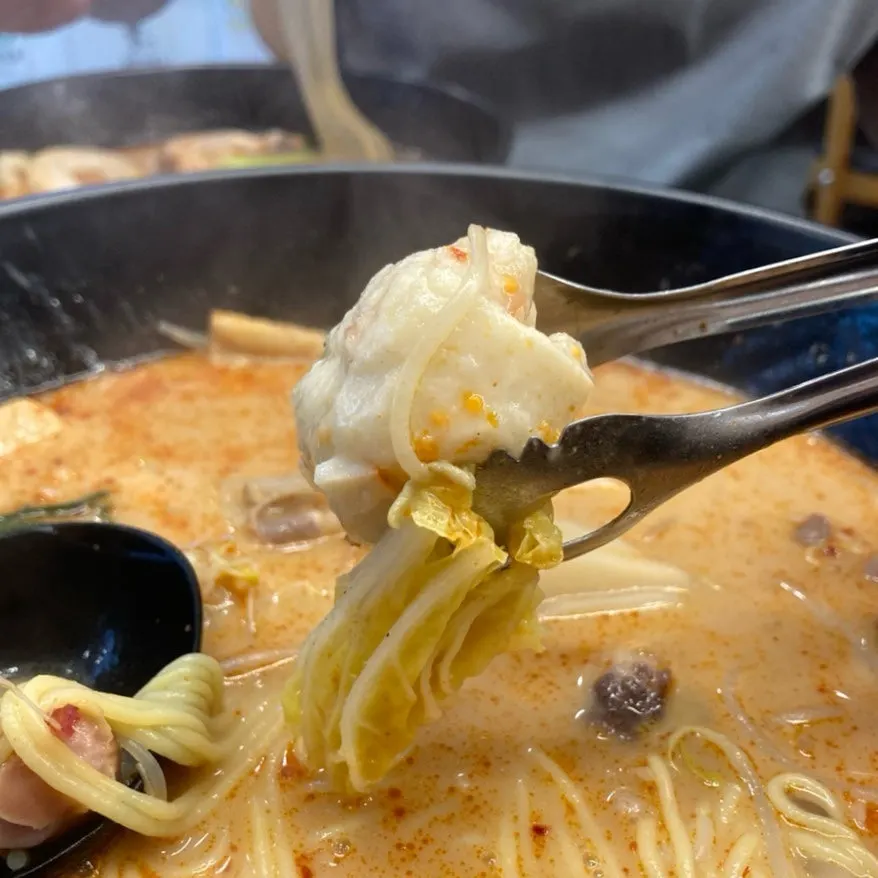 Malatang ingredients lifted out of the broth