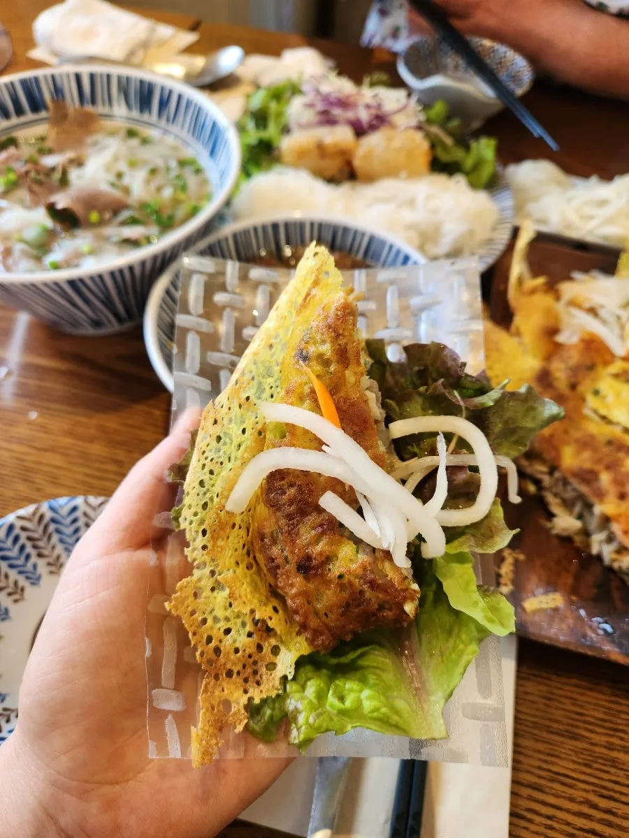Banh xeo and lettuce wrapped in rice paper