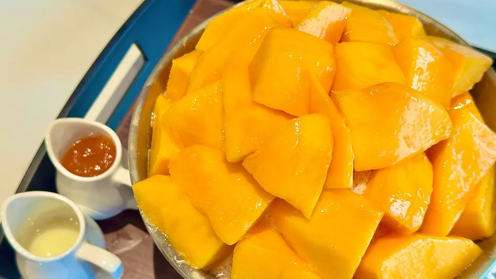 Table setting with two servings of apple mango bingsu at Lala Cafe
