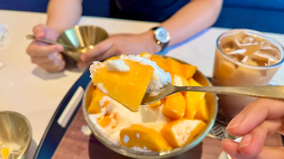 Close-up of bingsu topped with Seogwipo Theme Farm apple mango