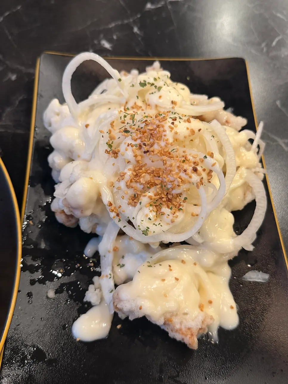 A plate of mini garlic butter tangsuyuk