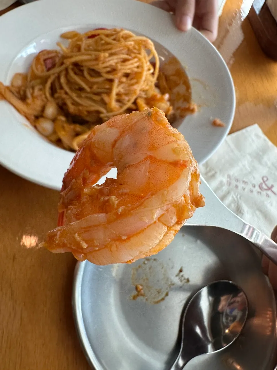 A plump, meat-filled whole shrimp in the mie goreng