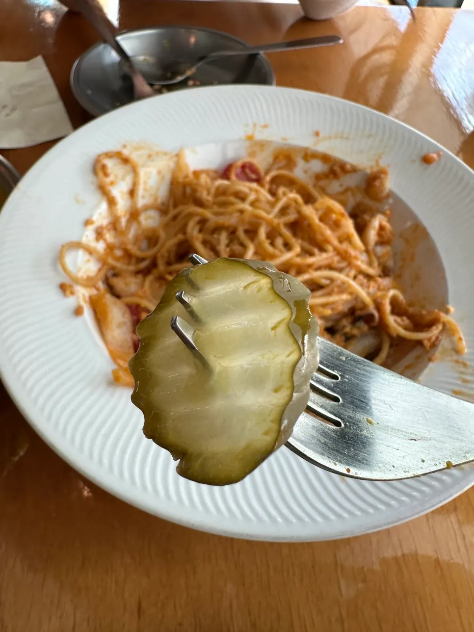 A plate of pickles served alongside the meal